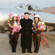 Image for article titled Kim Jong Un Visits Female Fighter Pilots, Picks Up Camera For Photo Op